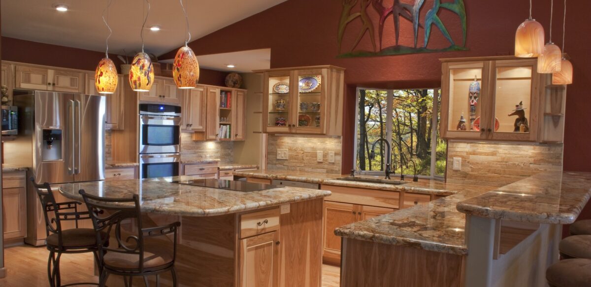 A luxury remodeled kitchen with granite countertops and stainless steel appliances