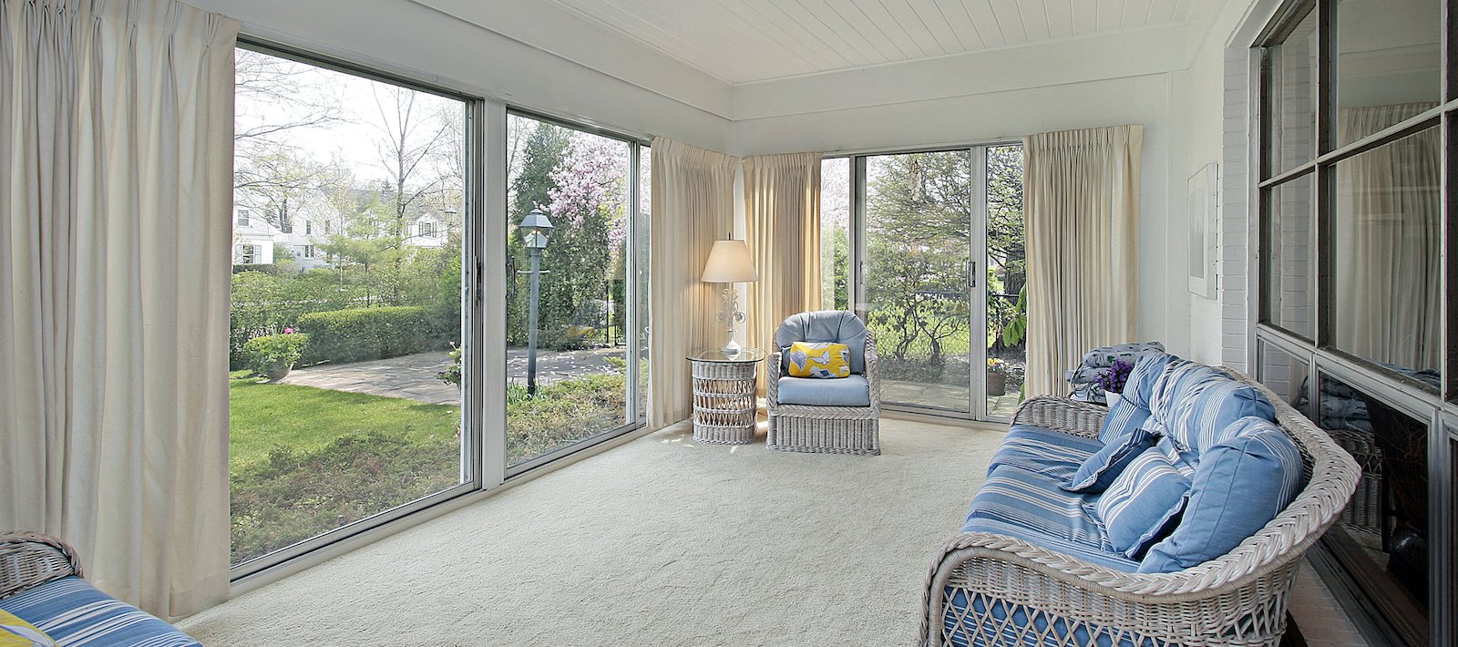 Sunroom in suburban home with patio view