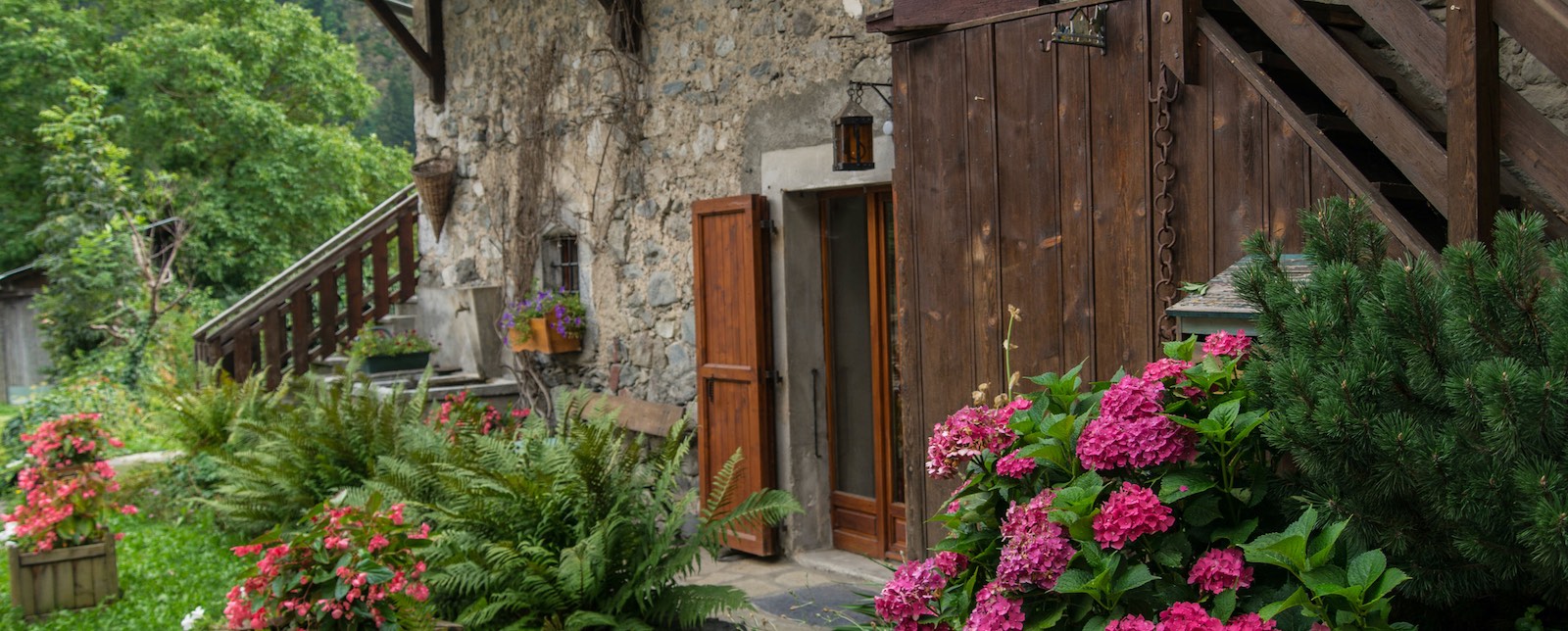 Reclaimed wood door on a gorgeous stone house