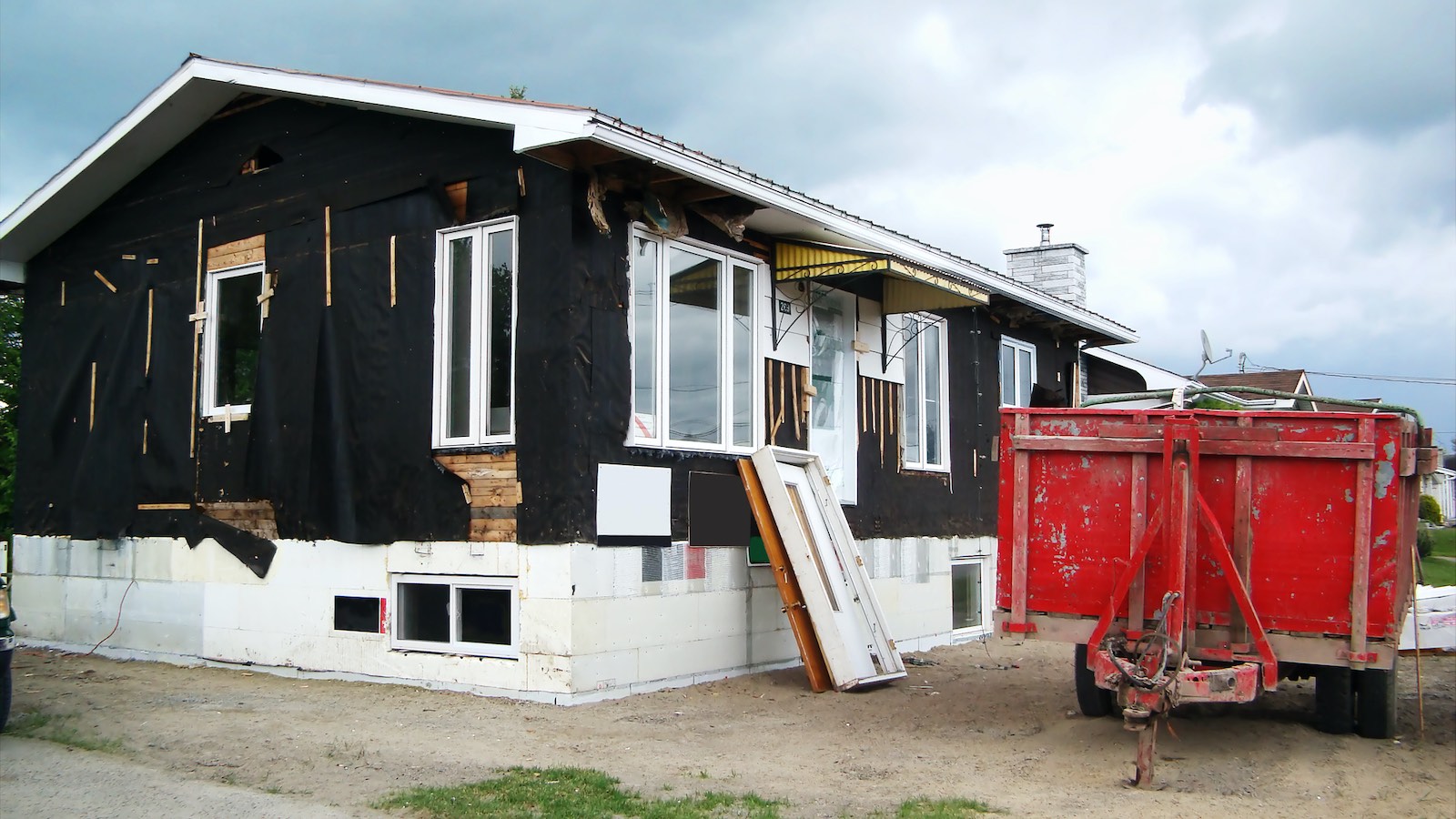 Removed siding on a beach bungalow - is it a teardown?