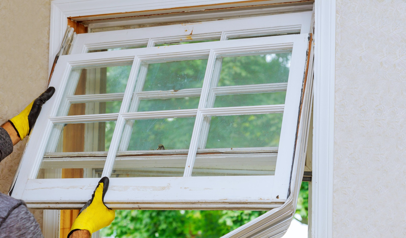 Replacing an older window with a new more energy efficient window.